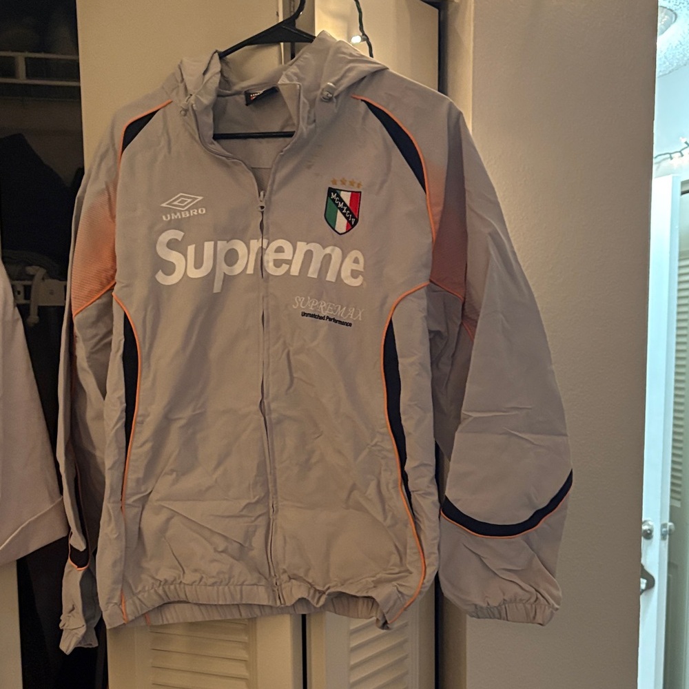 Supreme x Umbro Light Gray Jacket with Orange and Black Accents